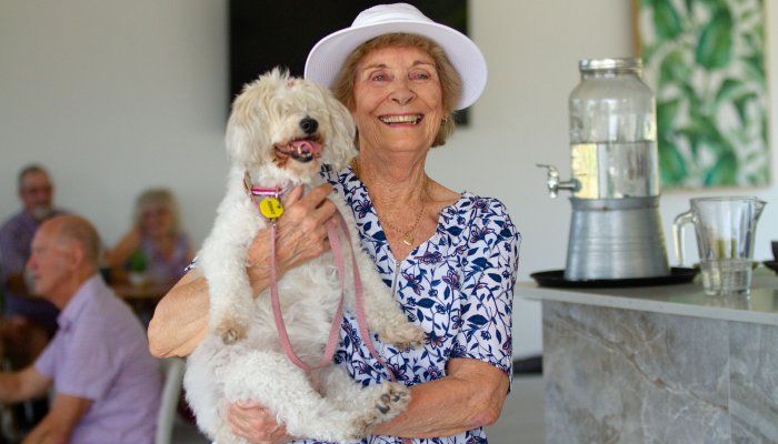 women with pet at retirement living community
